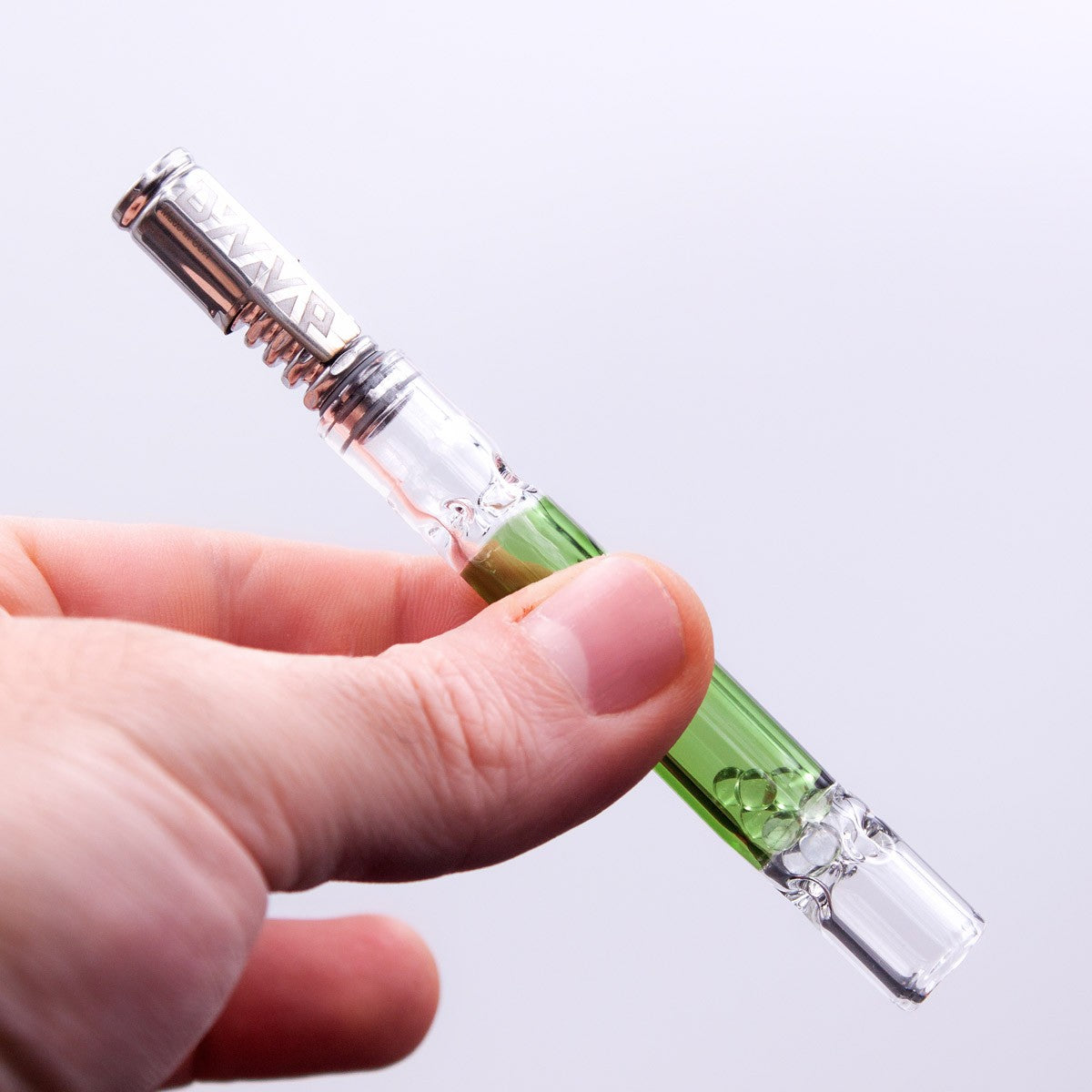 Close-up of Rattler Glass Cooling Stem for DynaVap held in hand, enhancing vapor smoothness