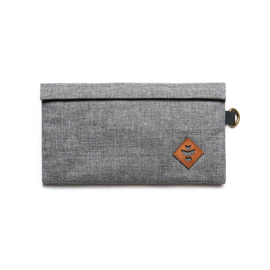 Revelry Supply Confidant in gray, front view, compact silicone pouch with leather logo patch