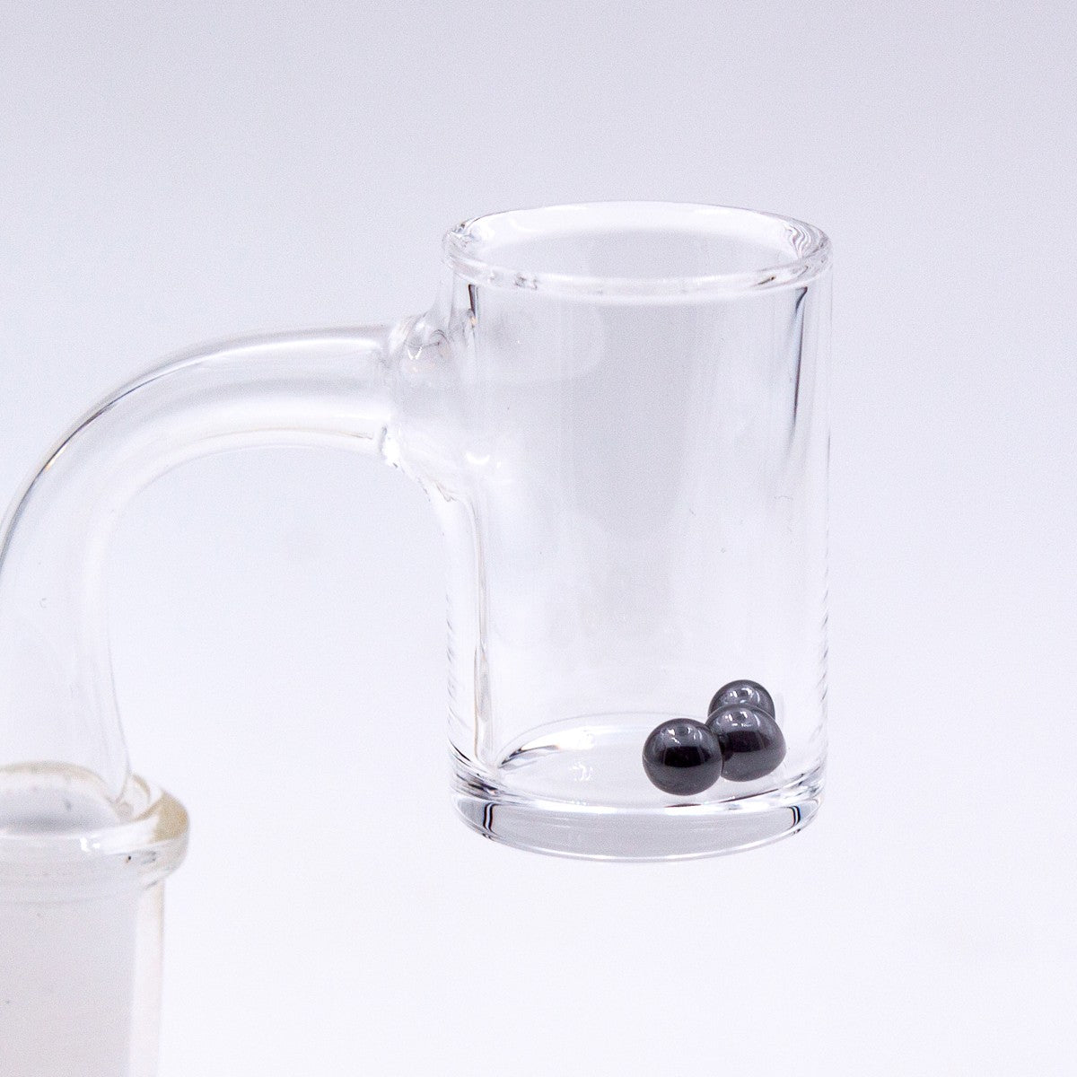Silicon Carbide Terp Pearls by The Stash Shack inside a clear glass dab rig attachment