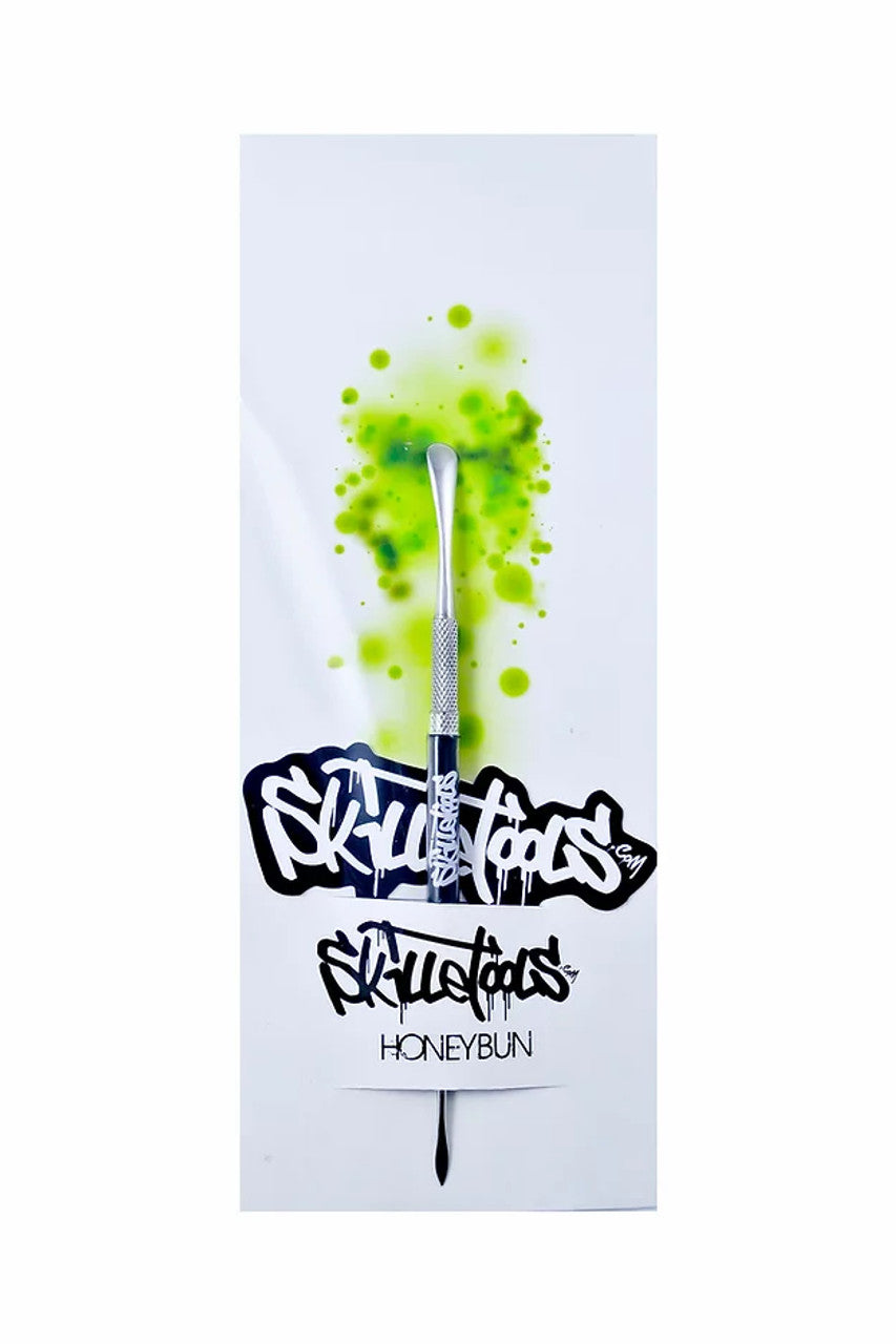 Skilletools Honeybun dab tool with steel spoon design for concentrates, 4" length, front view on branded card