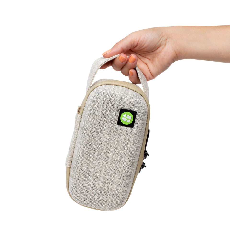 Hand holding Stashlogix Silverton Lockable Stash Case in Tan, front view on white background