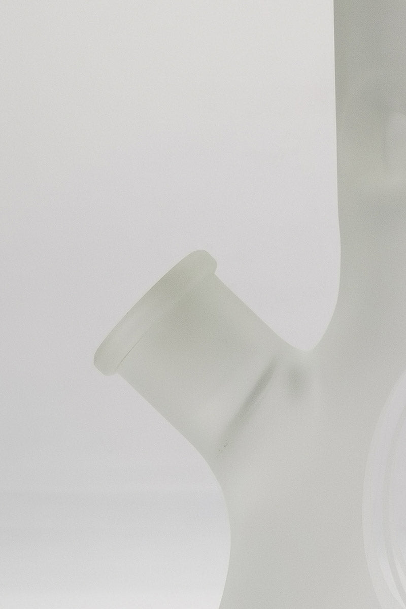 Close-up of TAG 12" Beaker Bong joint in frosted glass for dry herbs, 45 degree angle