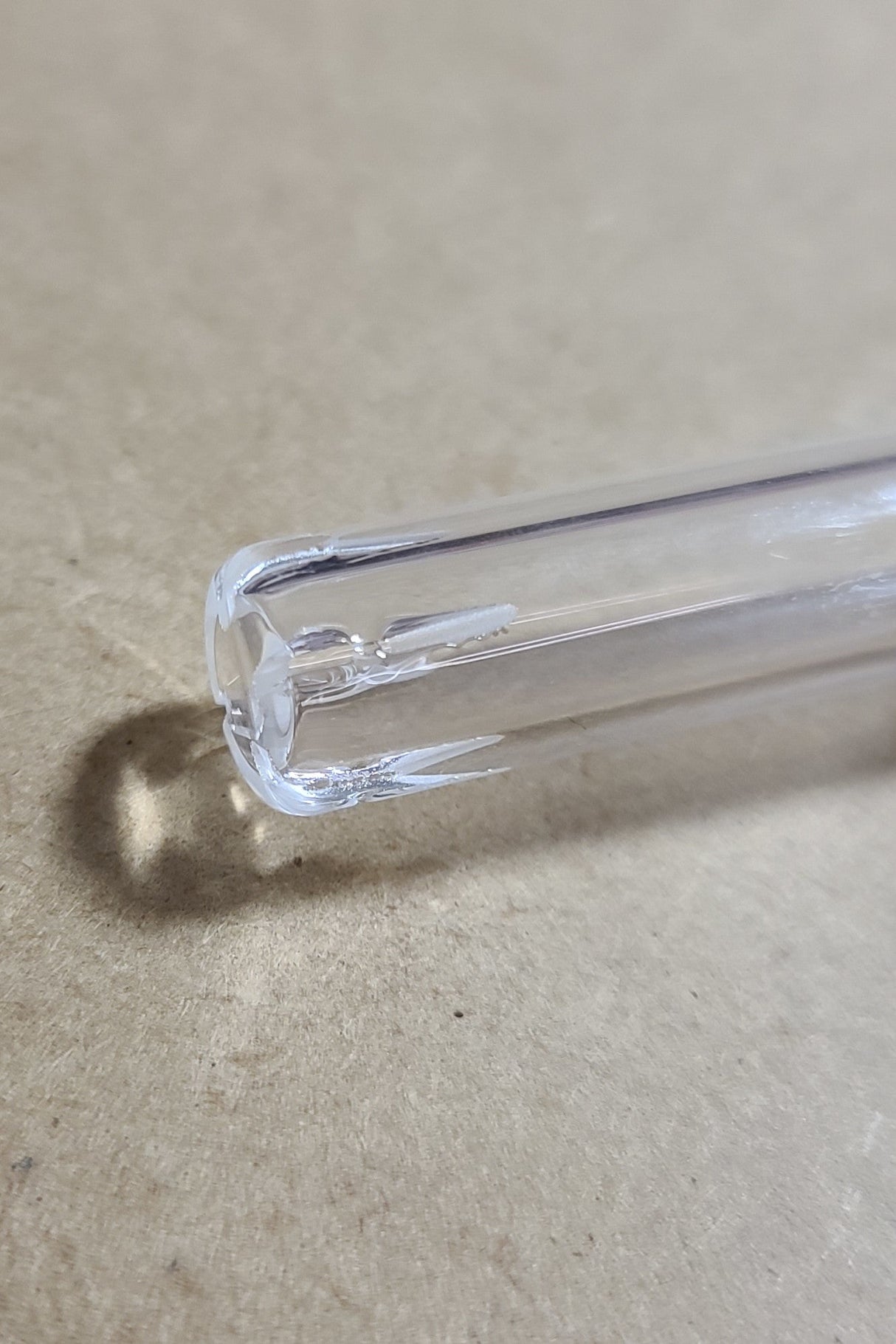 Close-up of TAG Quartz Closed End Showerhead Downstem for Bongs on a neutral background