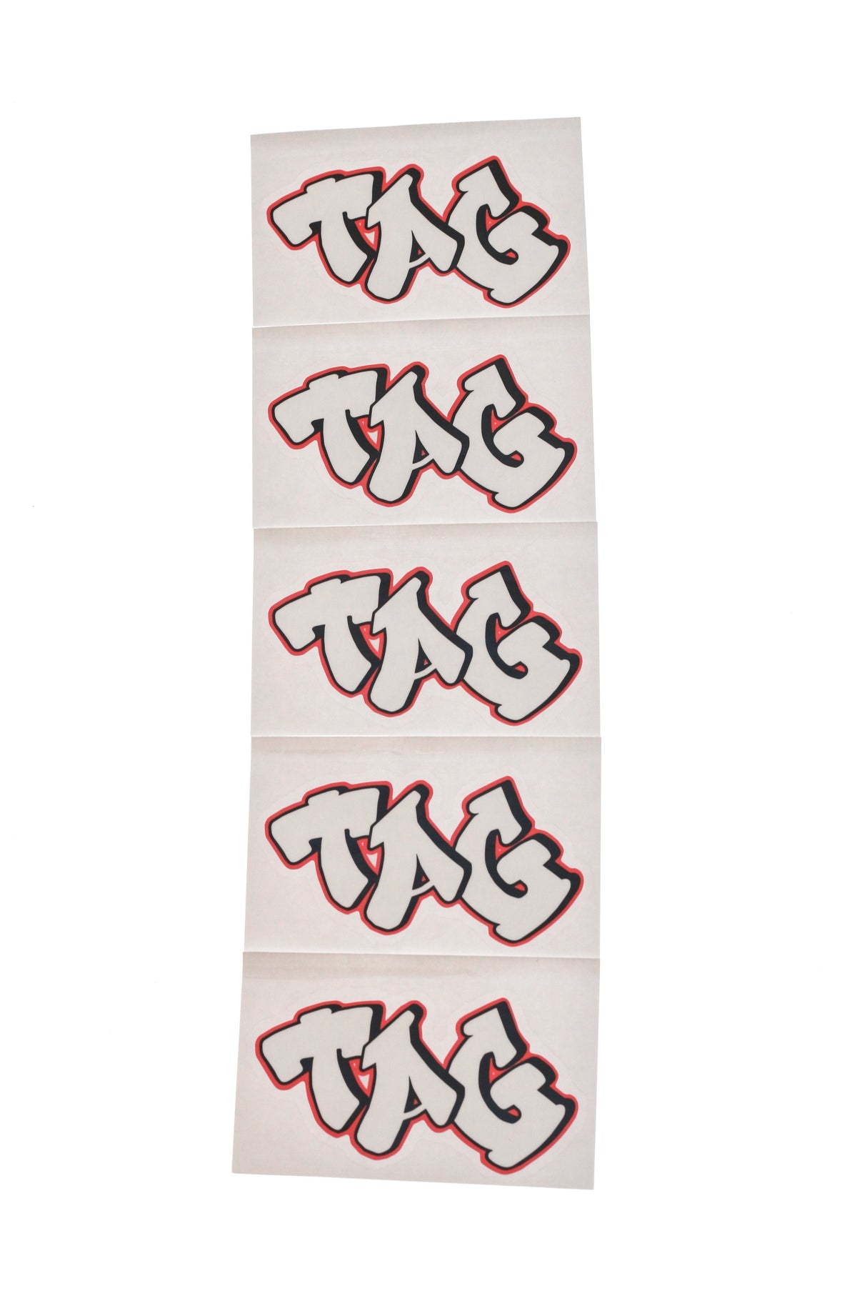 TAG branded 5-pack graffiti label stickers in white with red outline, front view
