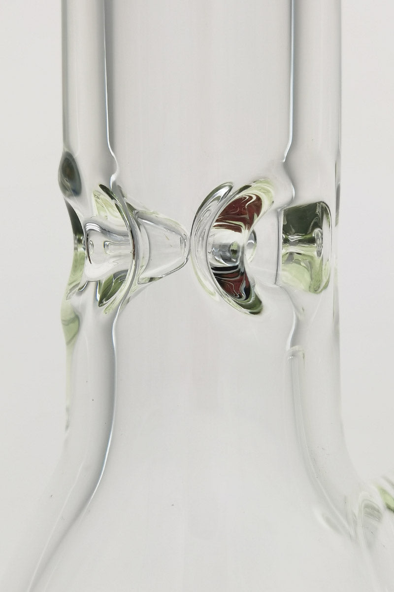 Close-up of TAG 30" Beaker Bong with Rasta color downstem on seamless white background