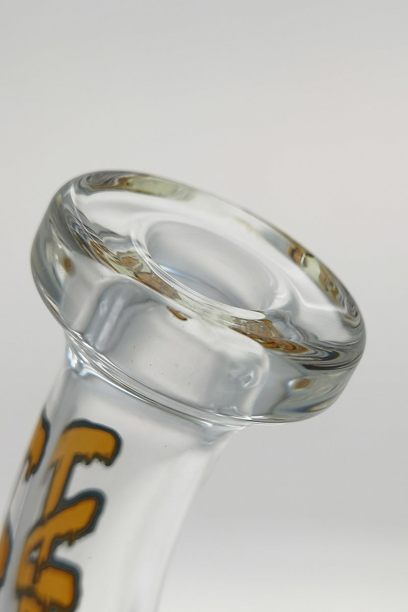 Close-up of TAG 8" Bent Neck Inline Diffuser's 14MM Female joint, with Thick Ass Glass logo