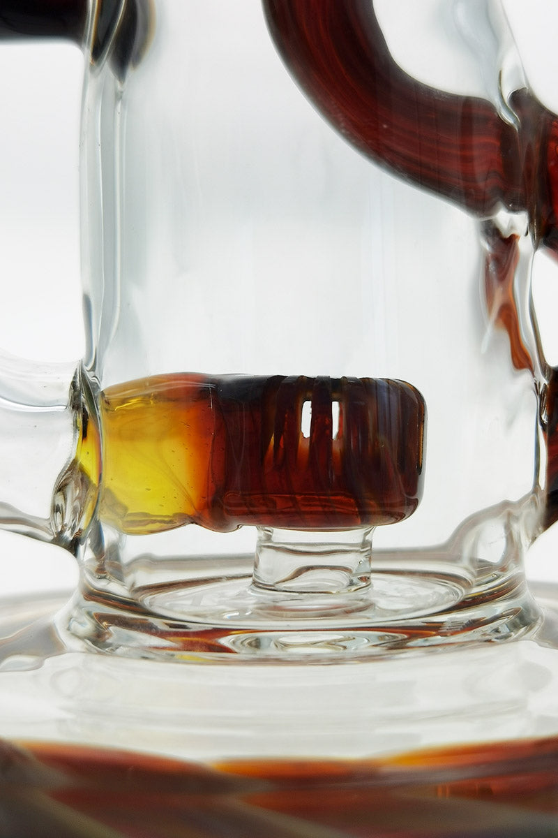 Close-up of TAG 8" Super Slit Puck Klein Incycler with amber accents and sturdy base