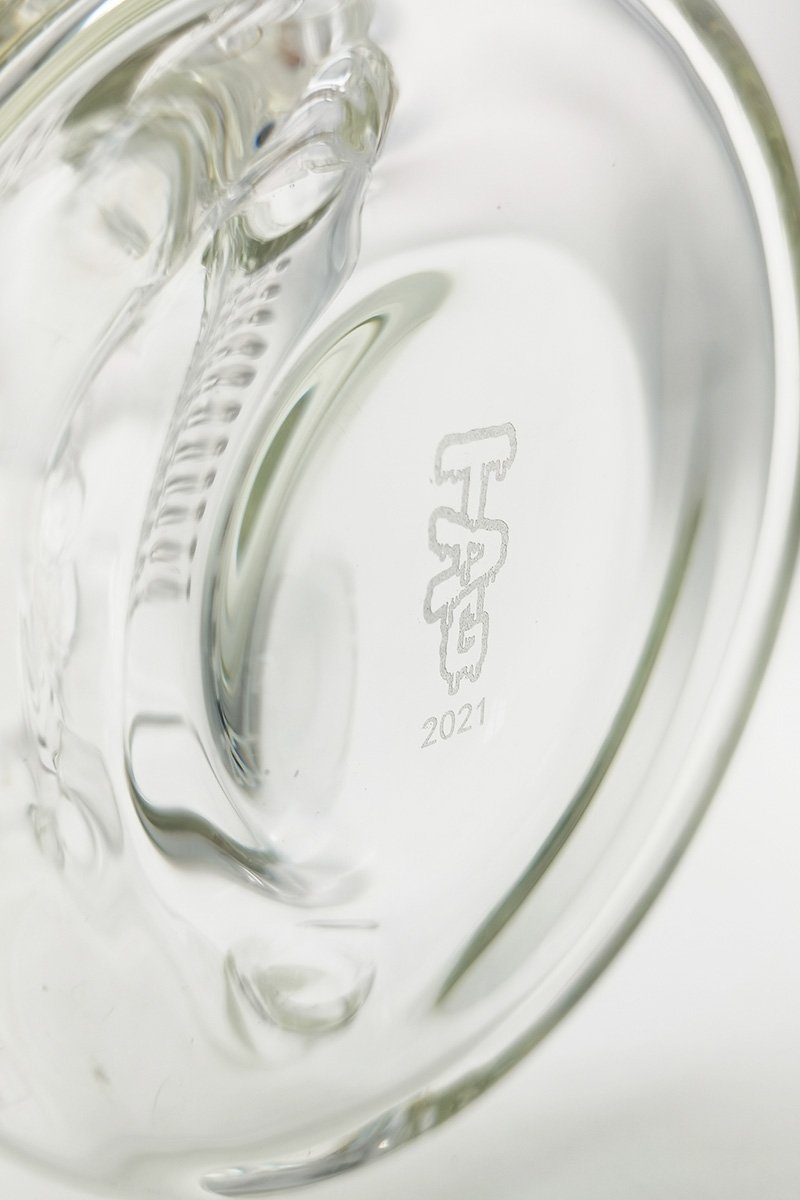 Close-up of TAG logo on 8.25" Inline Bellow Base Recycler Bong by Thick Ass Glass