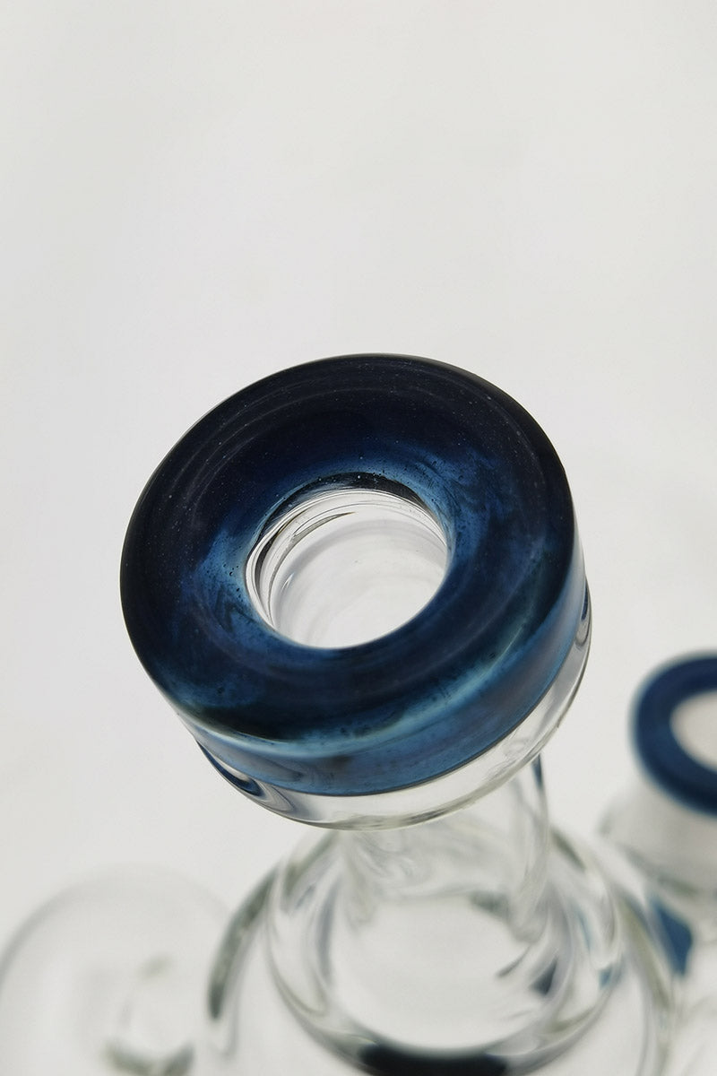 Close-up of TAG 9.5" Super Slit Donut Dual Arm Recycler with blue accents, 14MM Female joint