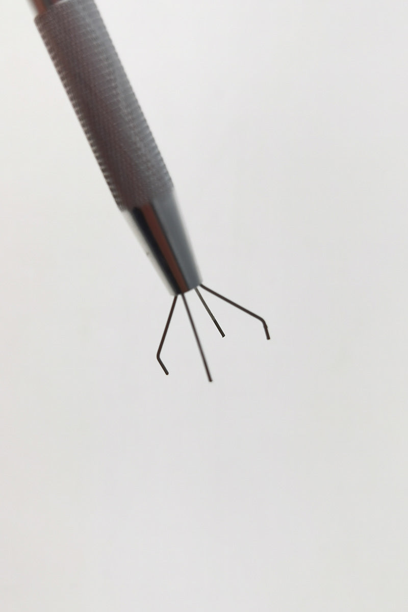 Close-up view of Thick Ass Glass Terp Pearl Quartz Ball Holder gripping a sphere