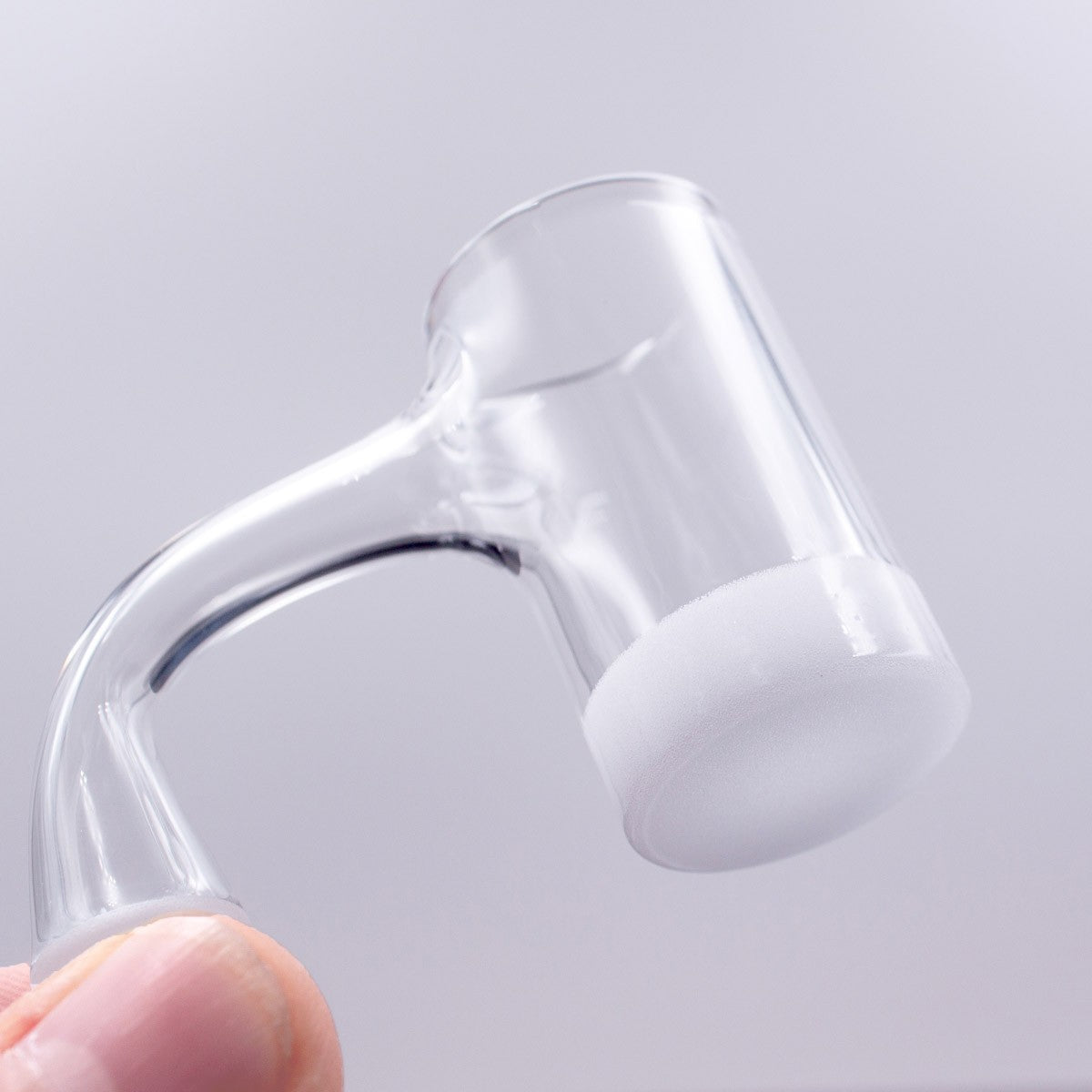 The Stash Shack Thick 8.5mm Opaque Bottom Full Weld Banger held in hand, close-up side view