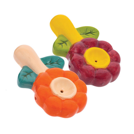 Colorful Wacky Bowlz Flower Ceramic Pipes in orange, red, and yellow on a white background