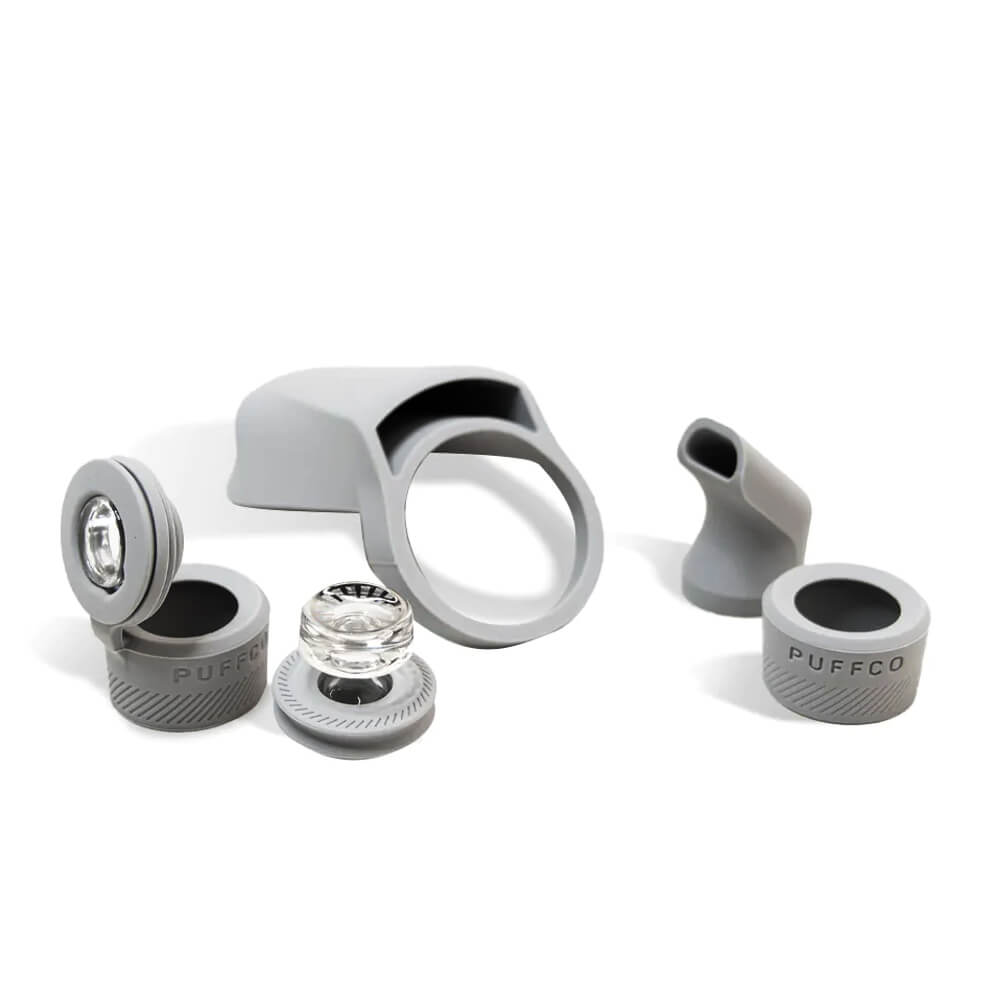 Puffco Peak Pro Travel Pack accessories displayed on white background, including silicone mouthpiece and carb cap