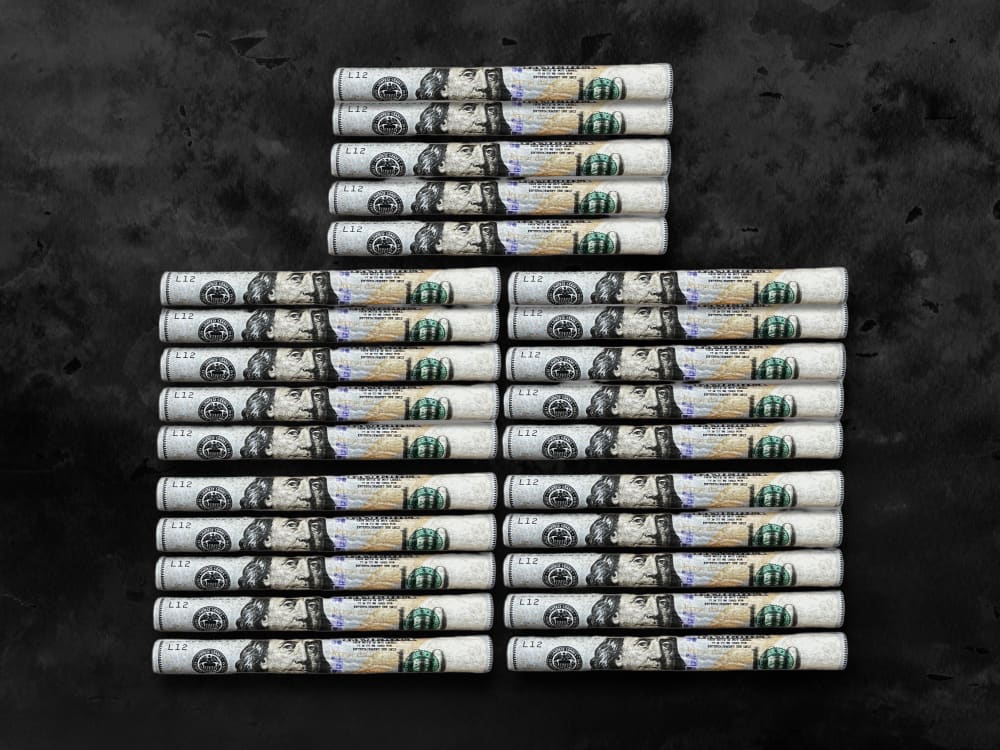 CaliGreenGold 100 Dollar Benny Hemp Blunt Rolls with Filters, 25-pack, on dark background