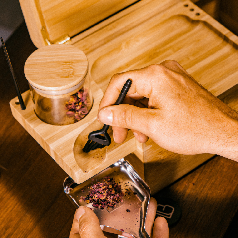 GENESIS Storage Stash Box by Blue Bus with accessories for dry herbs, top view on wooden surface
