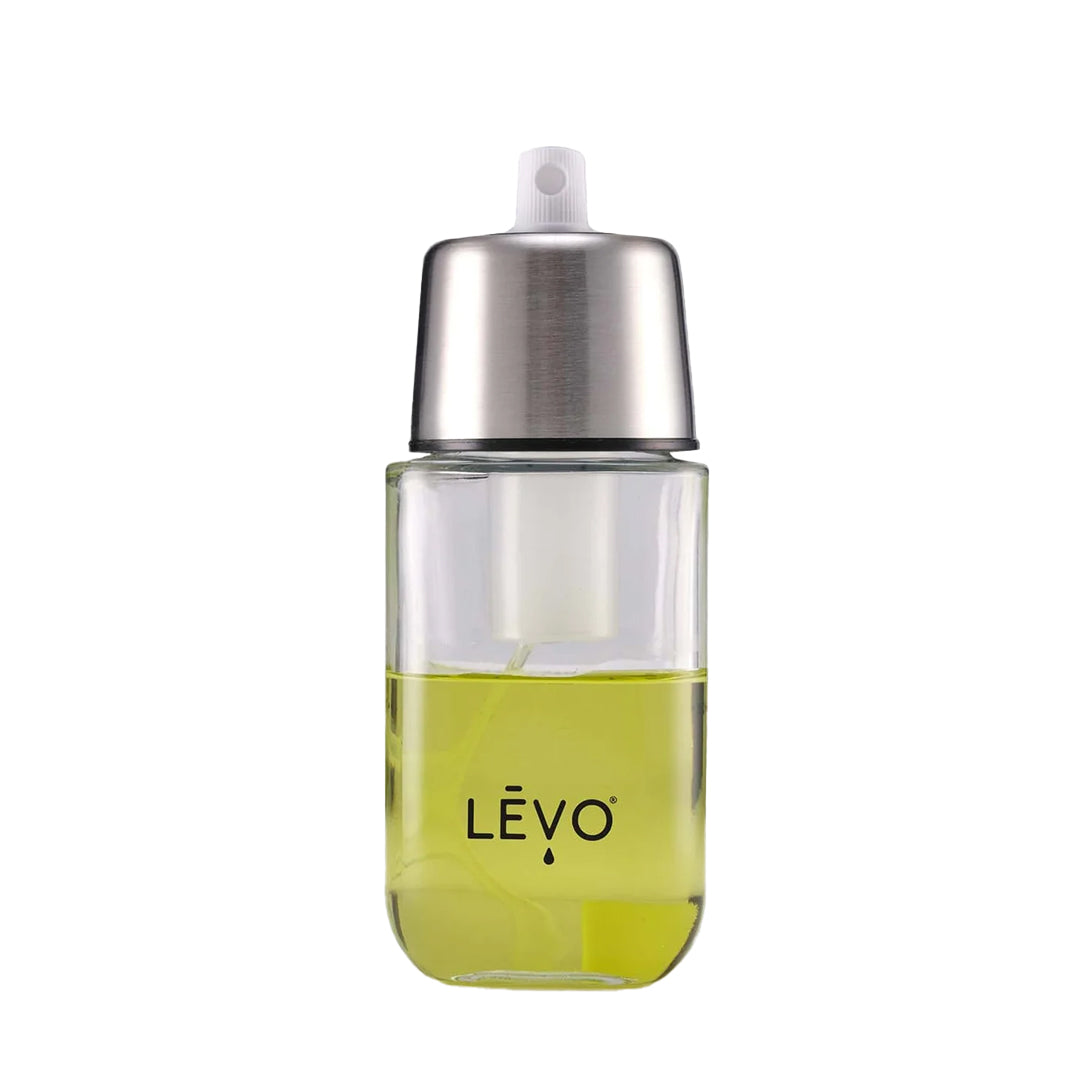 Levo Oil Easy Mist Infuser Sprayer filled with yellow oil, front view on white background