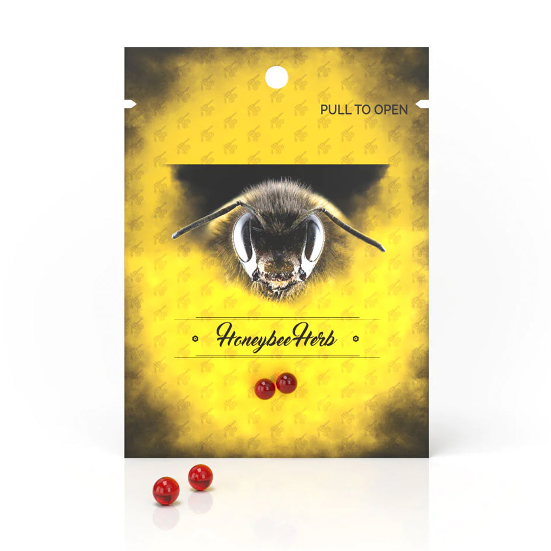 Honeybee Herb Terp Pearls in Ruby - various sizes displayed in front of branded packaging