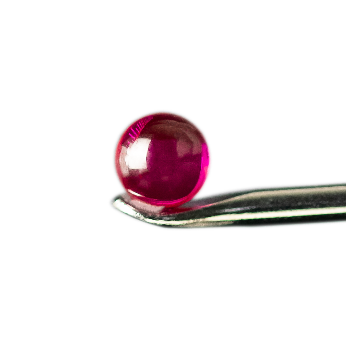 Close-up of MJ Arsenal Ruby Terp Pearl on metal tool against a white background, enhancing dab rig efficiency
