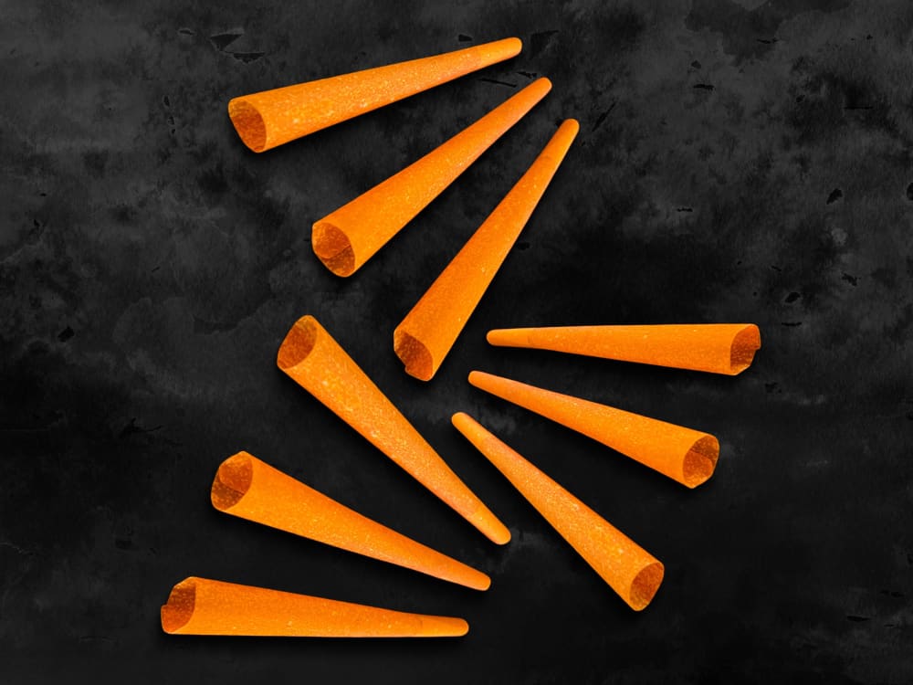 CaliGreenGold 9 Goji Berry Cones on black background, ready to roll for a unique experience