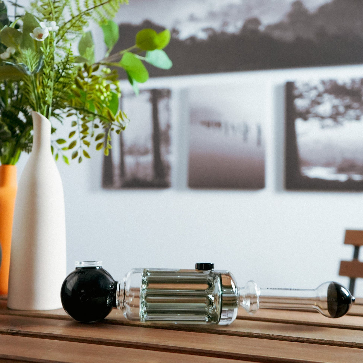 Freeze Pipe Steamroller on wooden table, clear glass with black accents, easy grip design