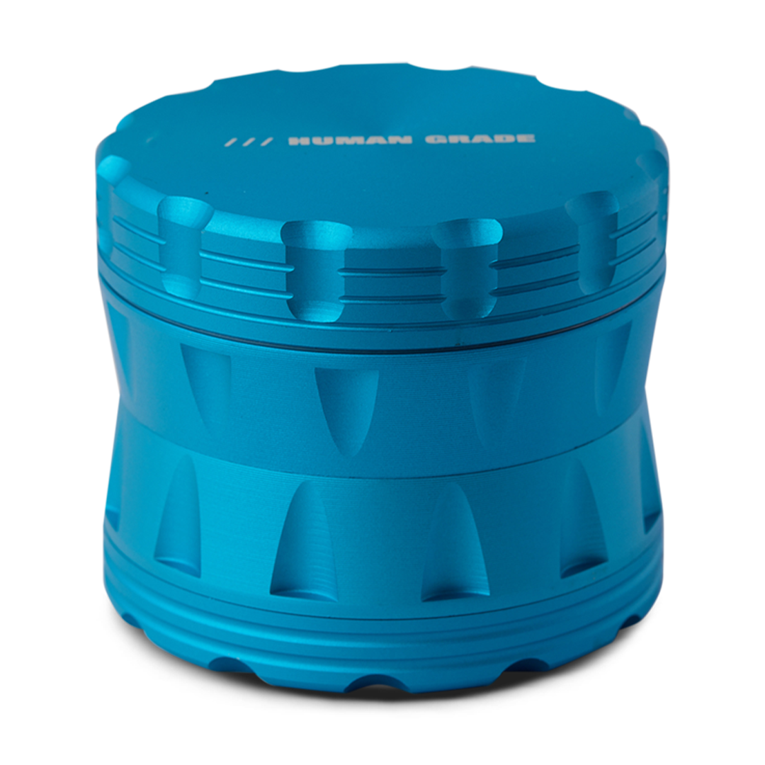 Human Grade Grinder 2A Light Blue - 2.5" 4-Piece Herb Grinder, Angled View on White