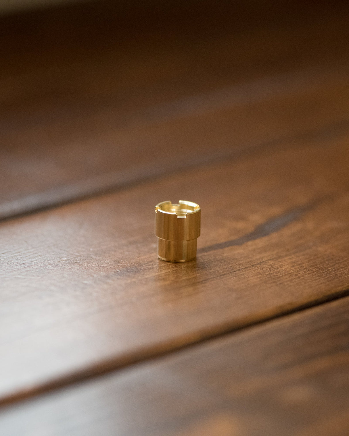 Helio Supply 510 SolPod Extended Magnetic Adapter on wooden surface, close-up