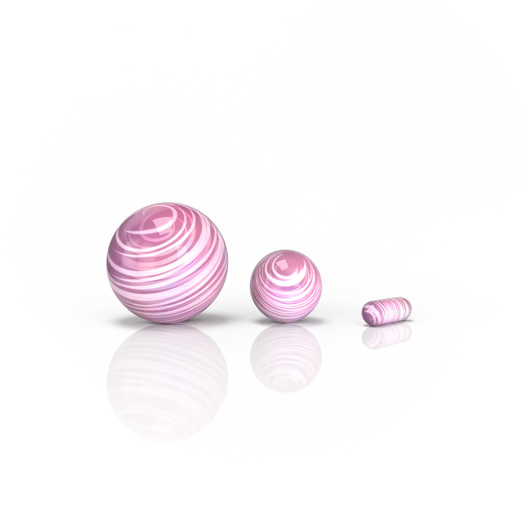 Honeybee Herb Dab Marble Set in Pink, Assorted Sizes on Reflective Surface