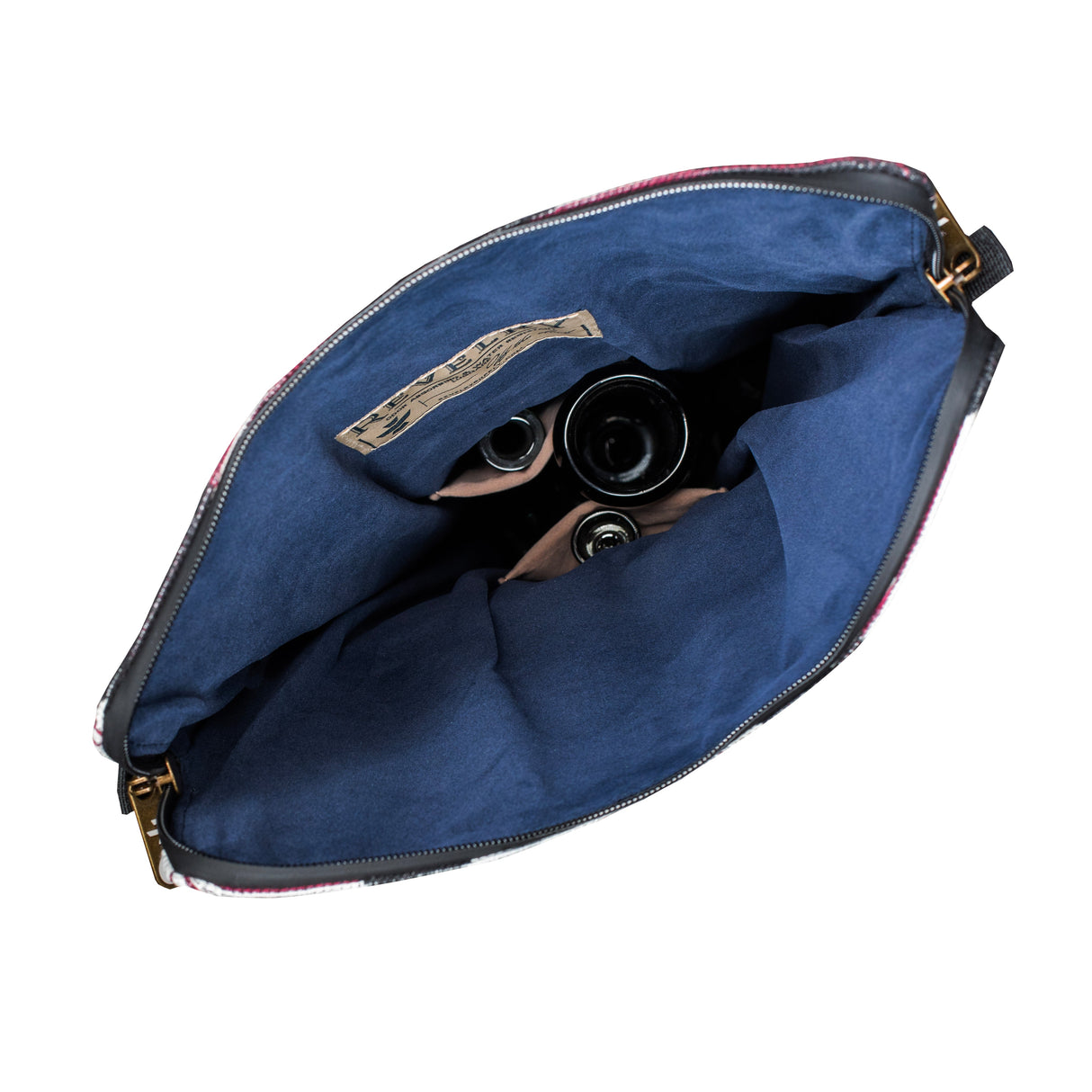 Revelry Supply 'The Defender' smell proof backpack open view showing padded interior and contents