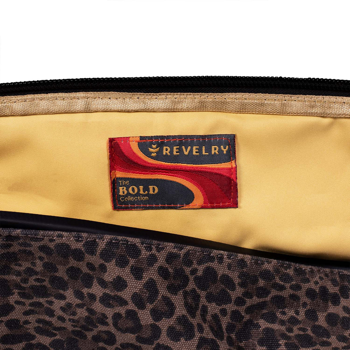 Close-up of The Drifter Smell Proof Rolltop Backpack by Revelry Supply with logo