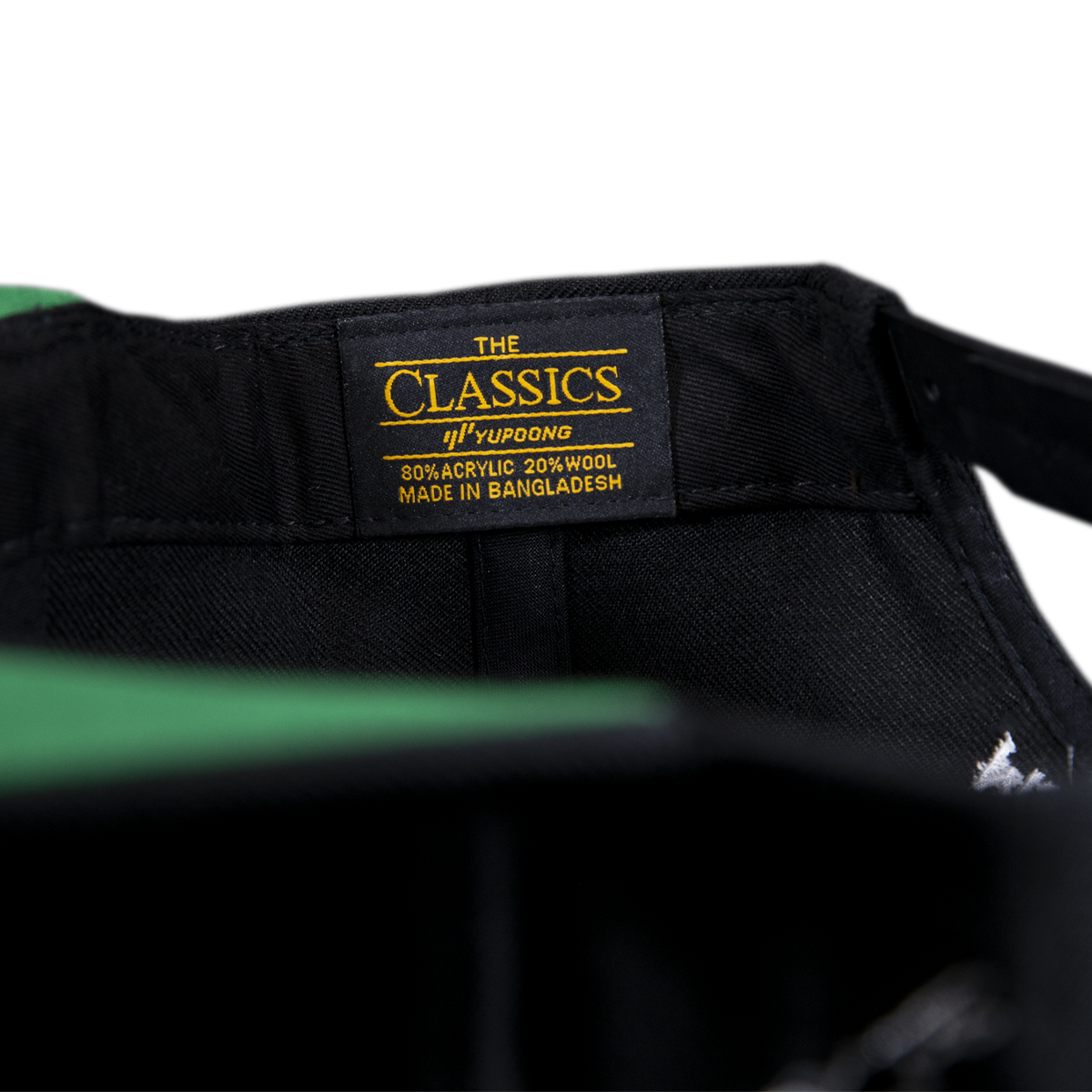 Close-up of MJ Arsenal Rainbow Logo Hat in black with a vibrant tag, perfect for stoner-dad style