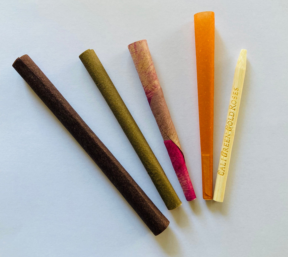 CaliGreenGold King Size Sampler with 4 different flavored rolling papers on white