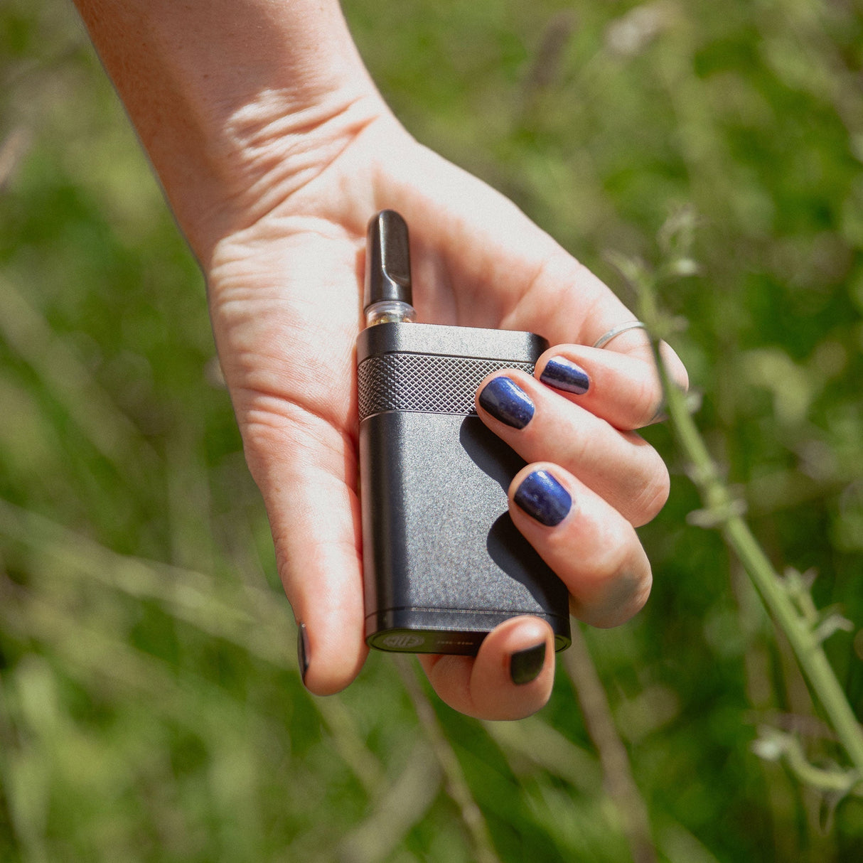 EDC Ranger Compact CCELL Battery Vape in hand, portable design, outdoor background