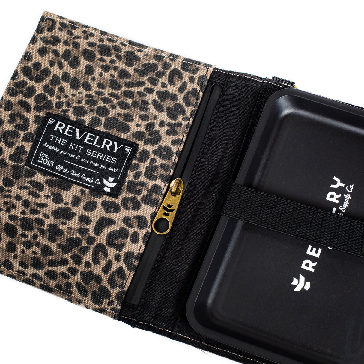 Revelry Supply The Rolling Kit open view showing smell proof containers and leopard print design