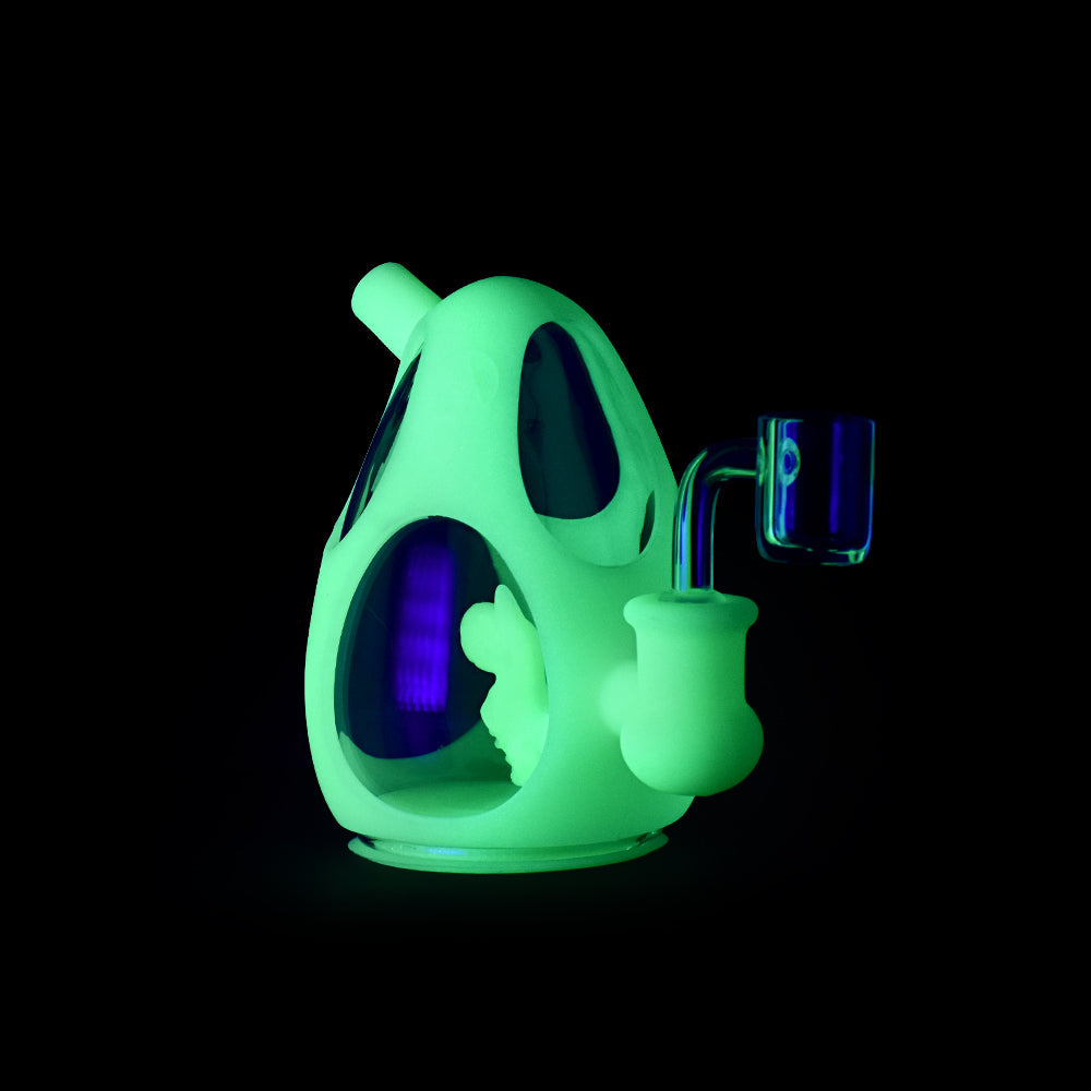 Ritual 5'' Silicone Dino Egg Rig glowing in UV light, front view, with titanium nail