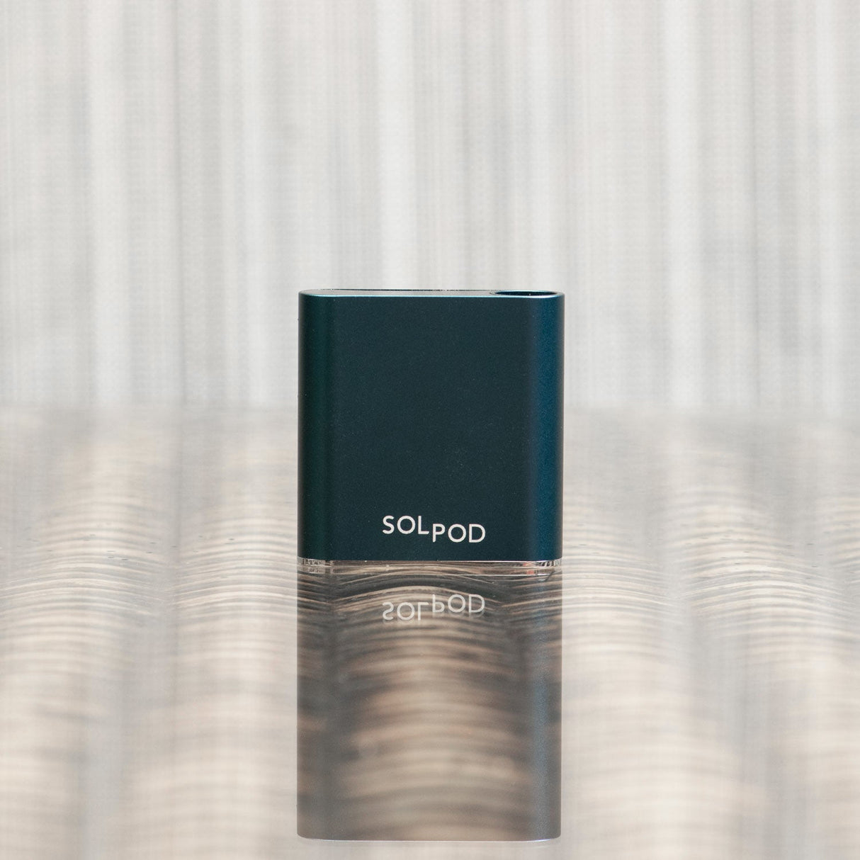 Helio Supply SolPod Express Kit - Compact Vaporizer Front View on Reflective Surface