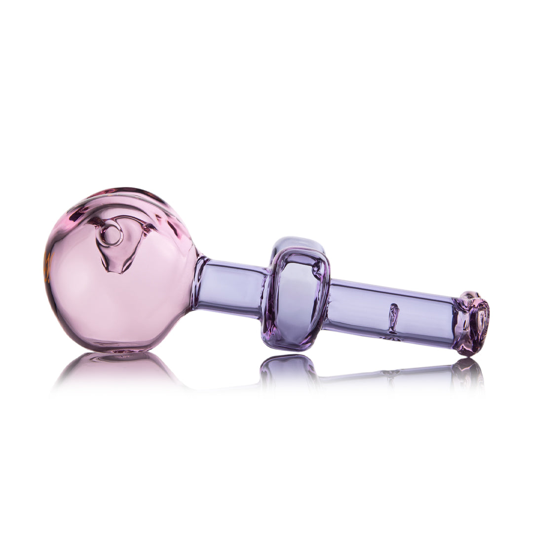MJ Arsenal Flutter Hand Pipe in pink for Valentine's 2024, side view on reflective surface