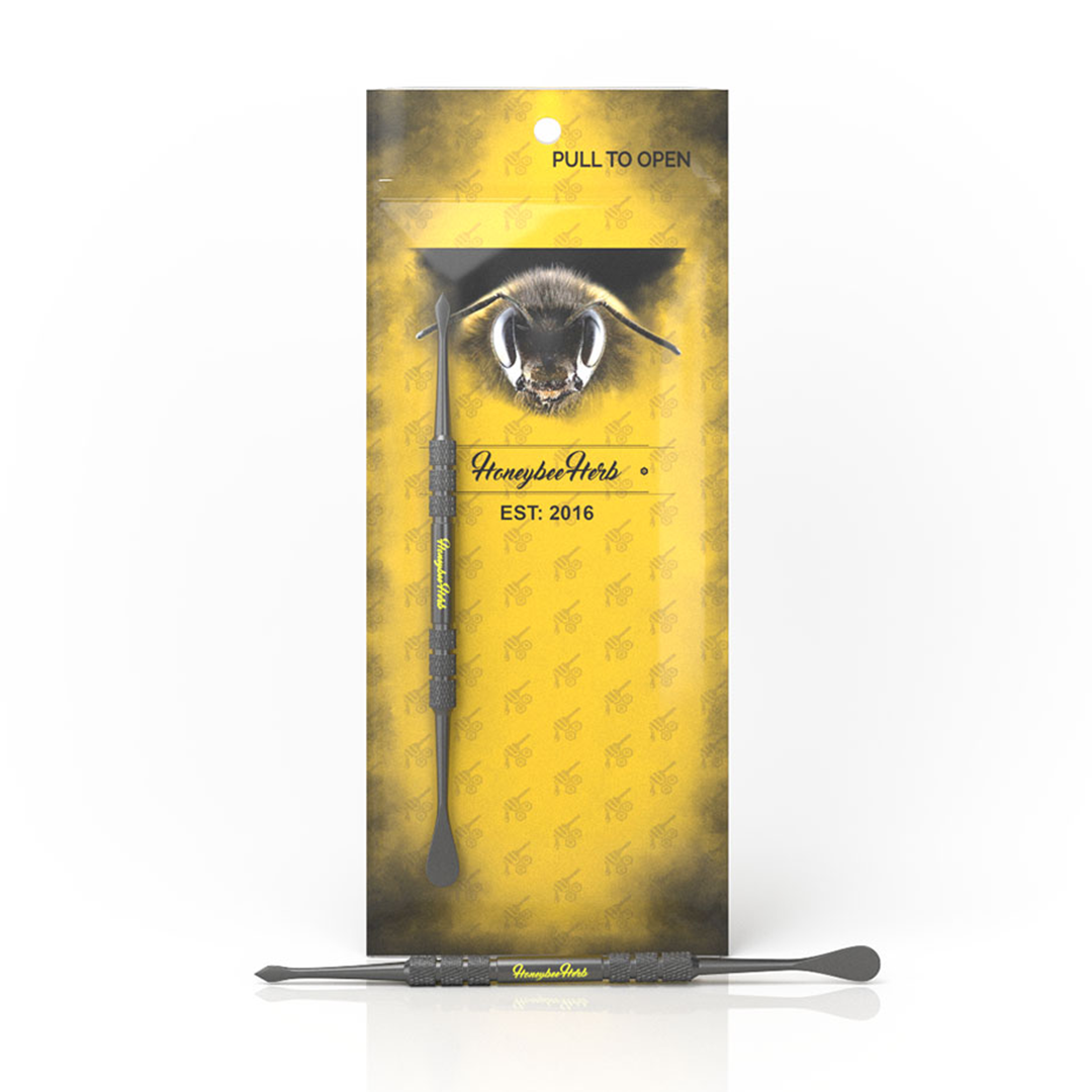 Honeybee Herb Stainless Dab Tool with sleek design and precision tip, front view on branded packaging