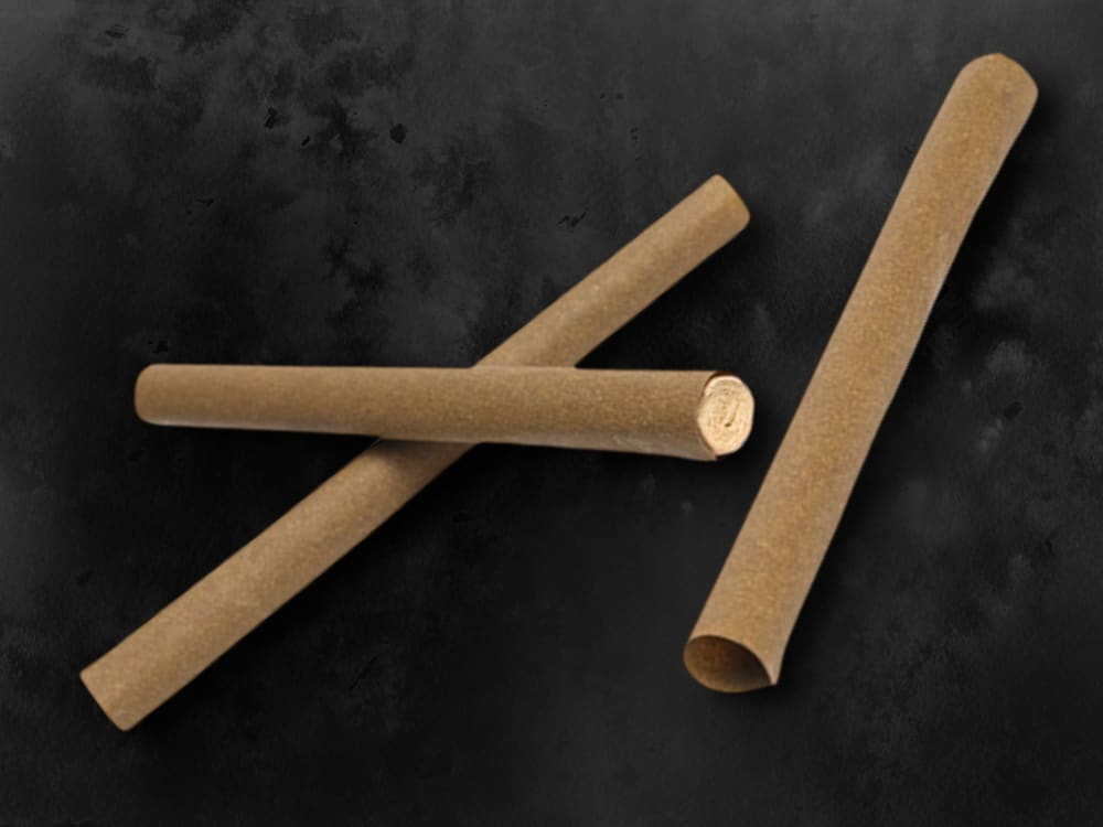 CaliGreenGold Brown Hemp Wraps 3-Pack with Cornhusk Filter Tip, Top View on Dark Background