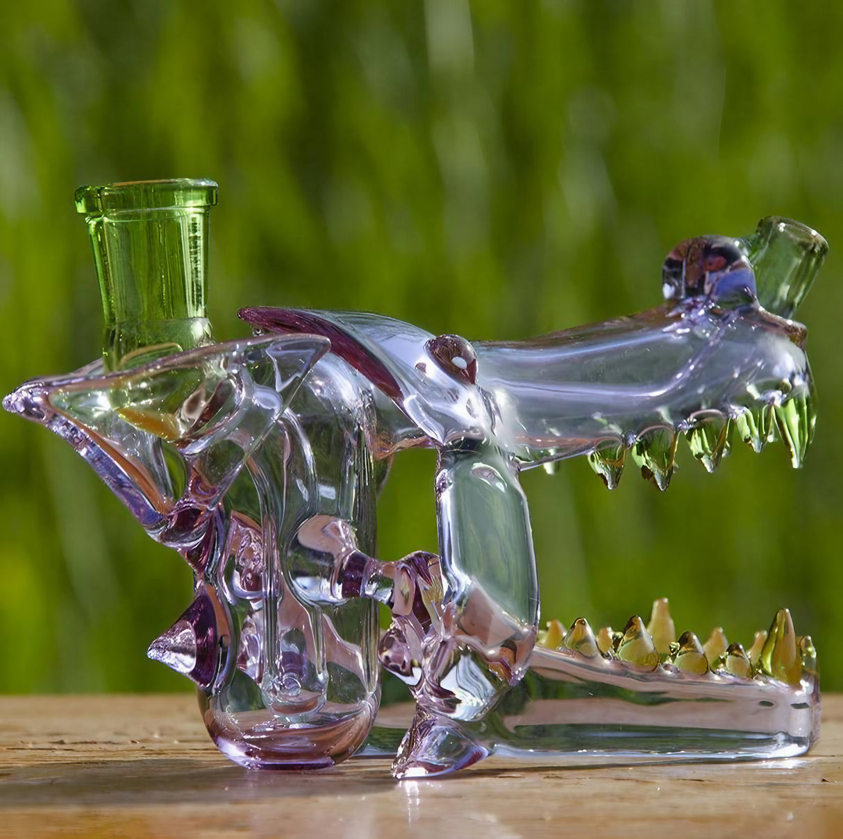 Calibear Wolf Head Dab Rig with Colorful Glass & Pinhole Perc, Side View on Wooden Surface