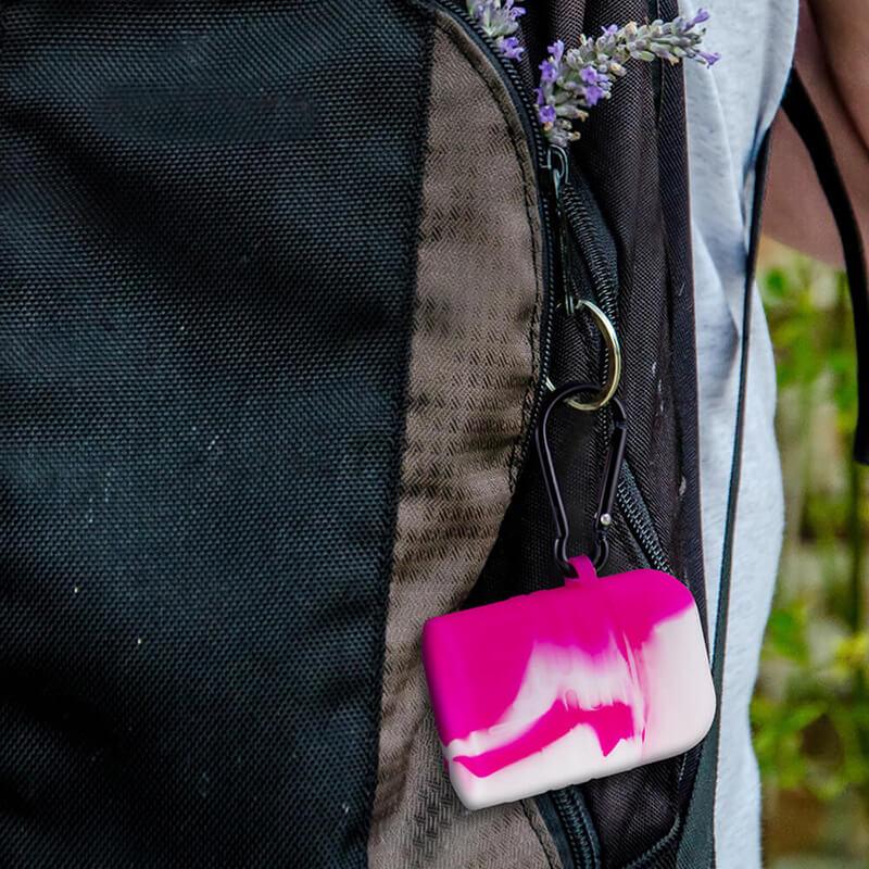 PILOT DIARY Silicone Dugout One Hitter Set in Pink attached to a backpack, easy for travel