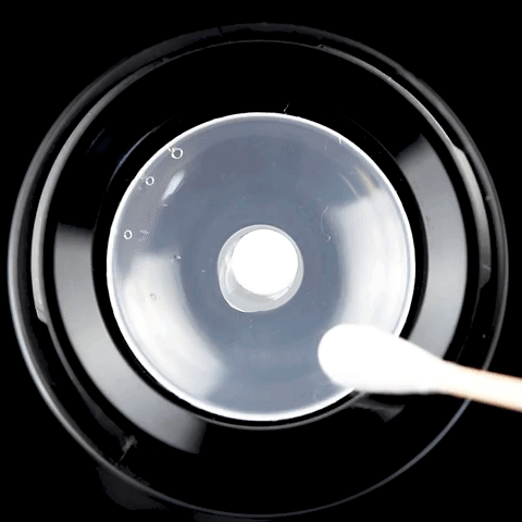 MJ Arsenal Clean Can with Glob Mops, cotton swab cleaning glass surface, top view