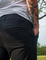 Close-up side view of GRAV Slim-fit Black Joggers with a sleek pocket design