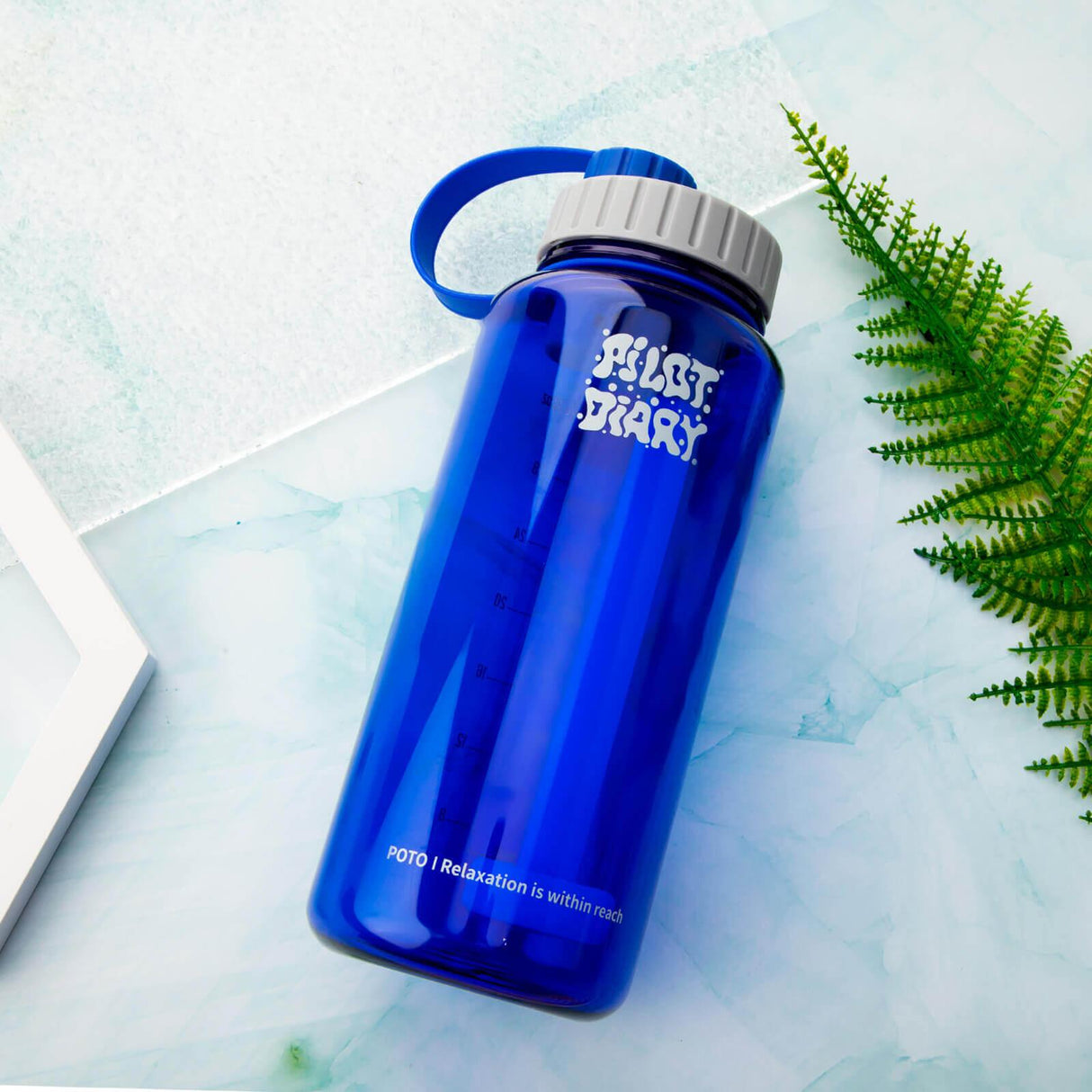 PILOT DIARY POTO Water Bottle Bong in Blue - Angled View on Marble Background