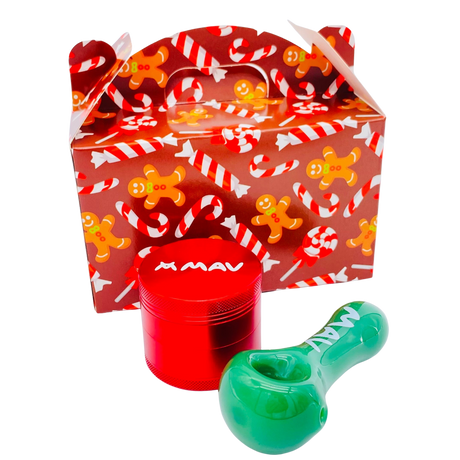 MAV Glass Holiday Package with red grinder and green spoon pipe in front of festive box