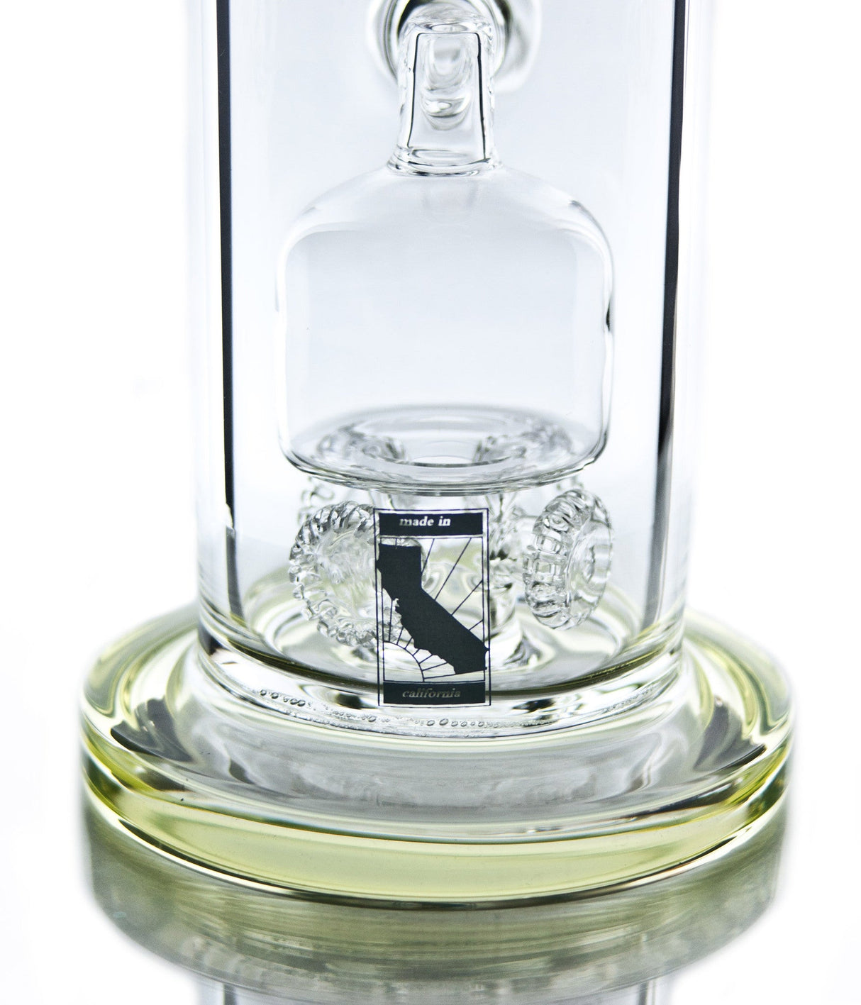 Close-up of MAV Glass 10'' Bong with Barrel to Quad Gear Perc, clear glass on seamless white background