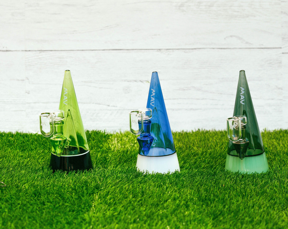 MAV Glass The Beacon 2.0 Dab Rigs in green and blue on grass, 7" height, 90-degree joint