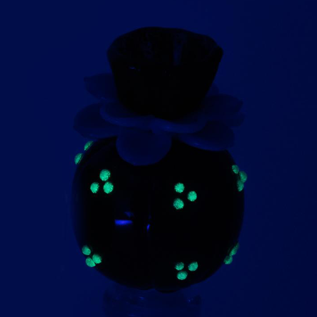Empire Glassworks glow-in-the-dark glass bowl piece for bong, front view on black background