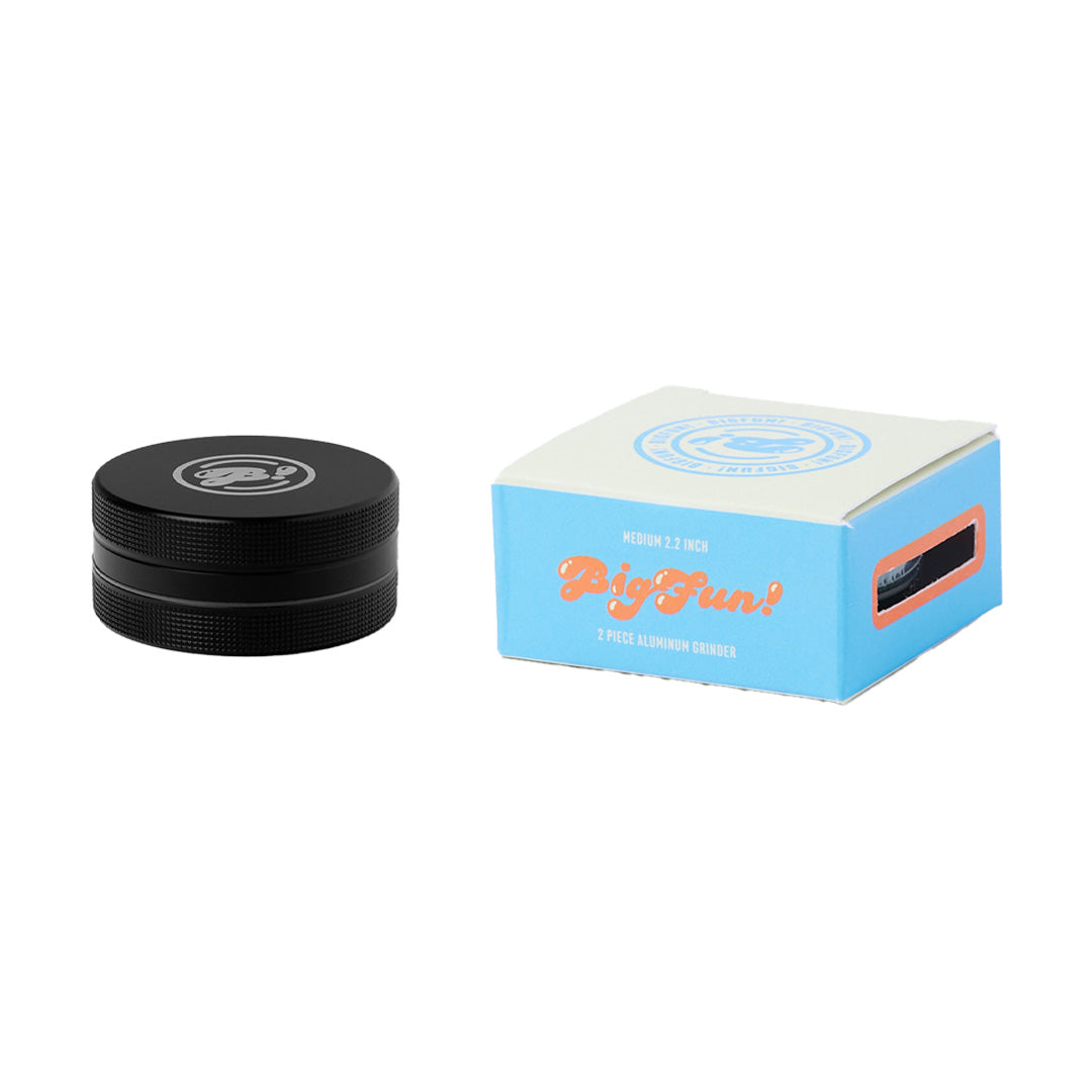 BIGFUN! Medium 2pc Grinder next to its packaging on a white background