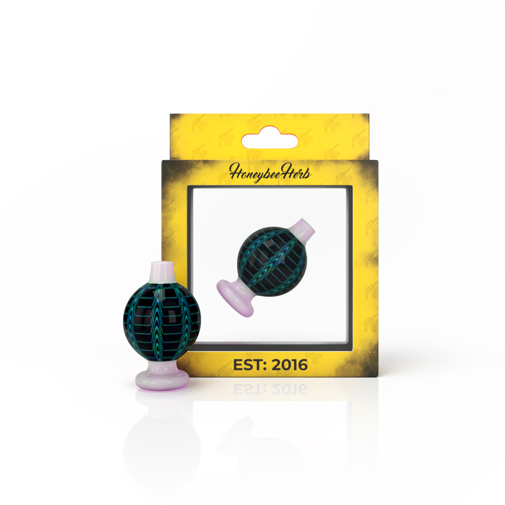 Honeybee Herb Dream Bubble Carb Cap in Pink, Glass Dab Tool for Rigs, Front View on Packaging