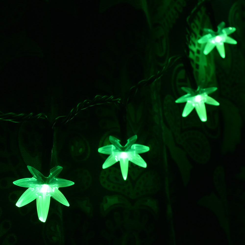 Pulsar Mini High Lights with glowing green hemp leaf-shaped LED bulbs, 16 feet long, against dark background